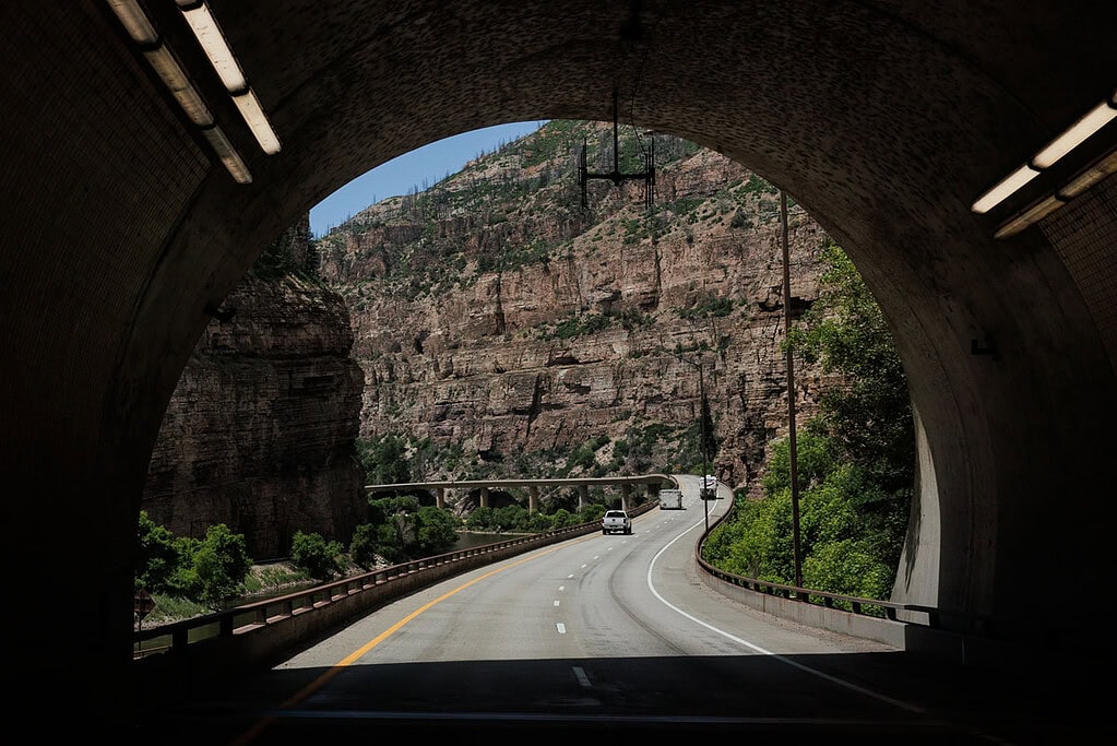 a mountain interstate weaving through a rugged Colorado canyon